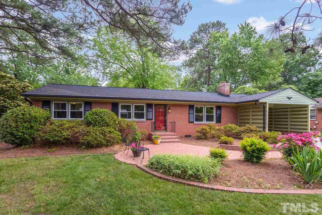 5113 Wickham Road Raleigh, NC 27606 - Photo 2 of 25 a front view of house with yard and outdoor seating
