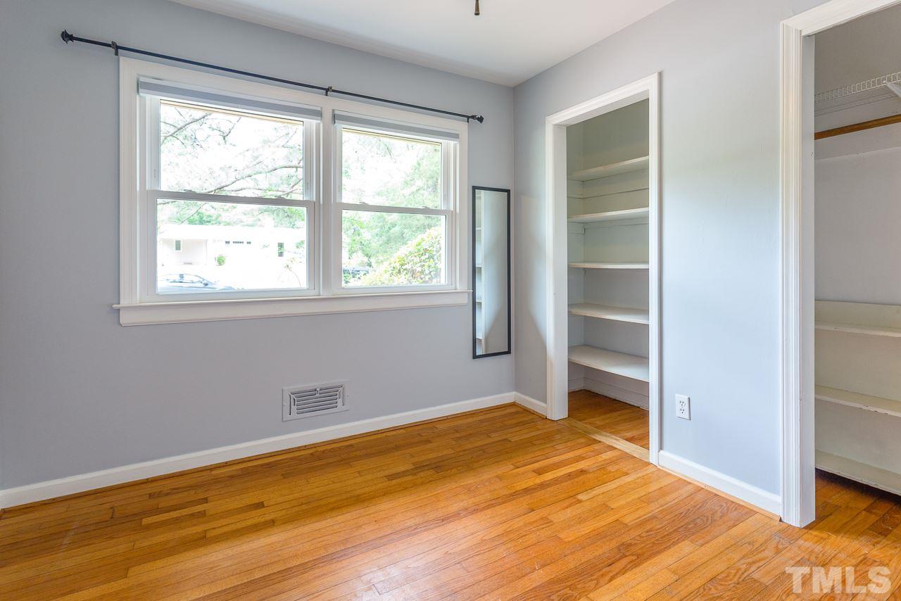 5113 Wickham Road Raleigh, NC 27606 - Photo 19 of 25 a view of empty room with wooden floor and fan