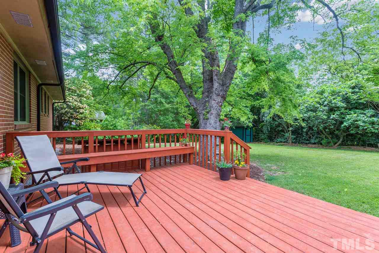 5113 Wickham Road Raleigh, NC 27606 - Photo 20 of 25 a view of a roof deck with wooden floor and fence