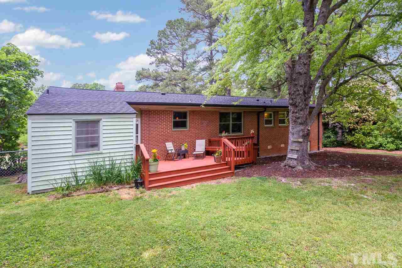 5113 Wickham Road Raleigh, NC 27606 - Photo 24 of 25 a front view of a house with patio and garden