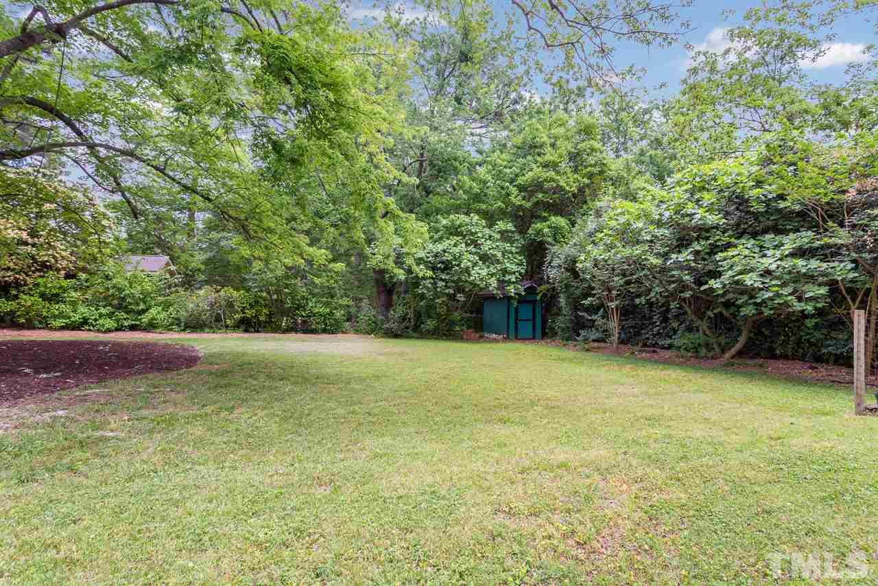 5113 Wickham Road Raleigh, NC 27606 - Photo 25 of 25 a view of a yard with a trees
