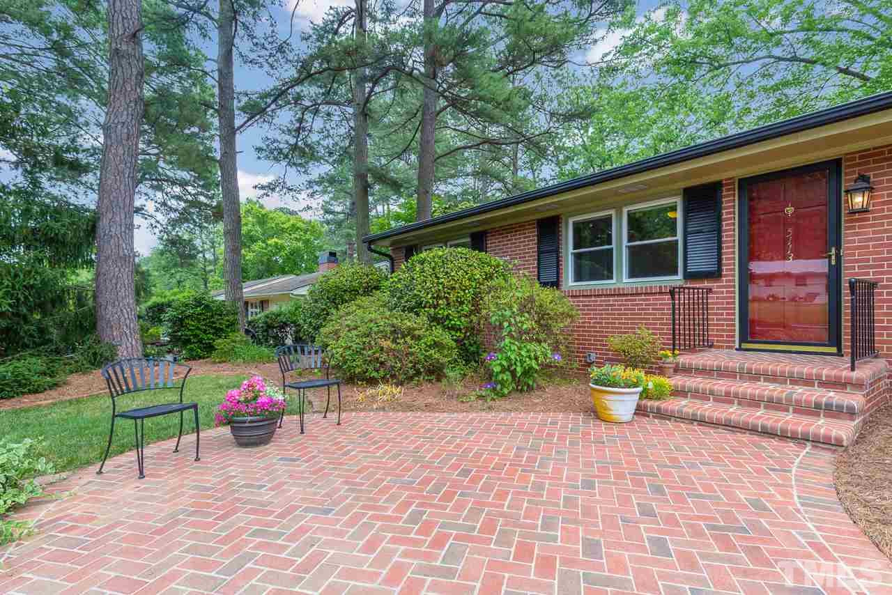 5113 Wickham Road Raleigh, NC 27606 - Photo 5 of 25 a front view of a house with a yard