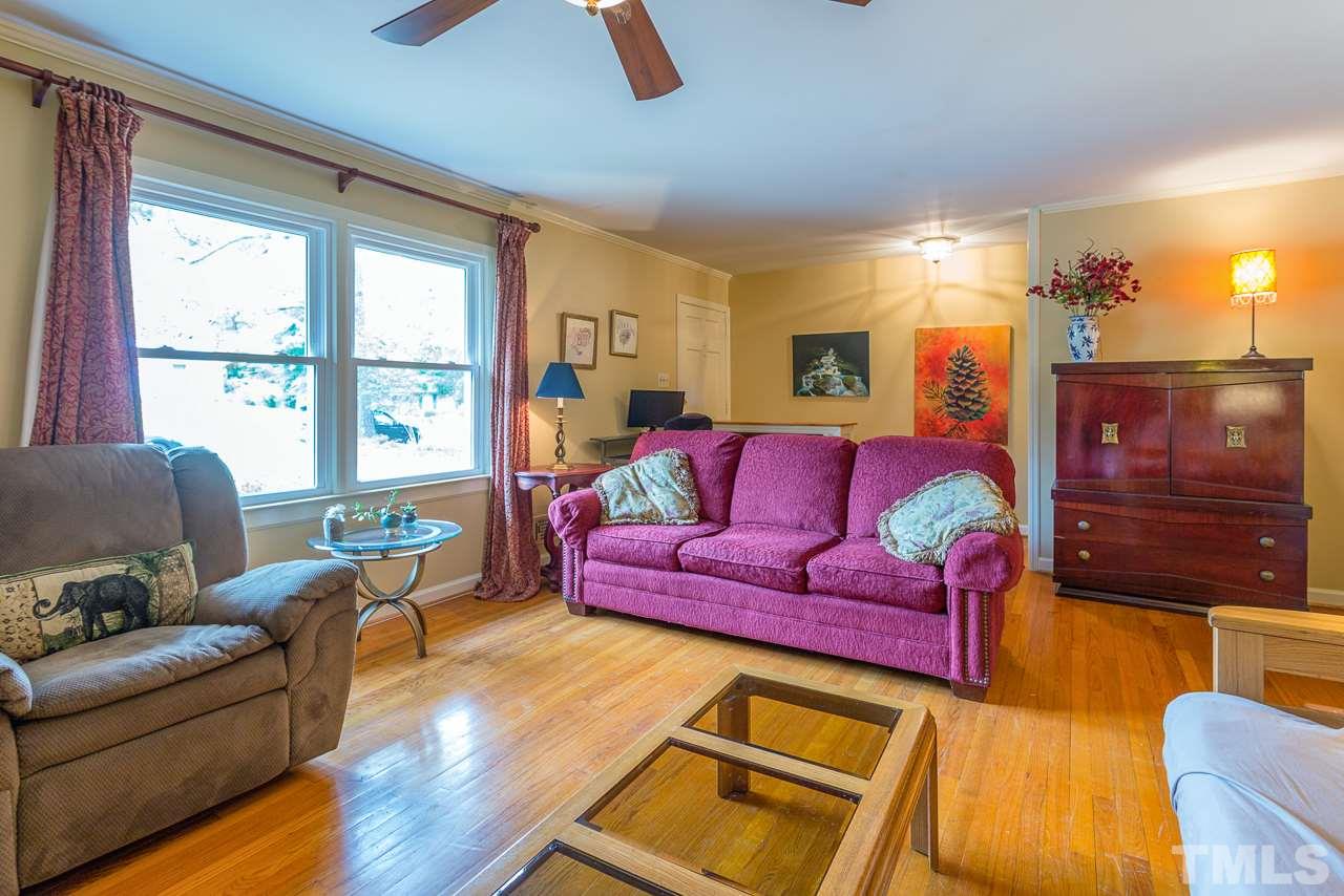 5113 Wickham Road Raleigh, NC 27606 - Photo 6 of 25 a living room with furniture and a window