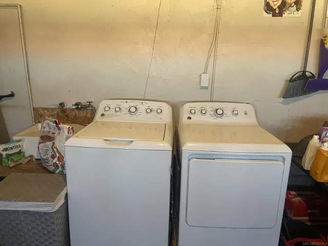 a utility room with dryer and washer