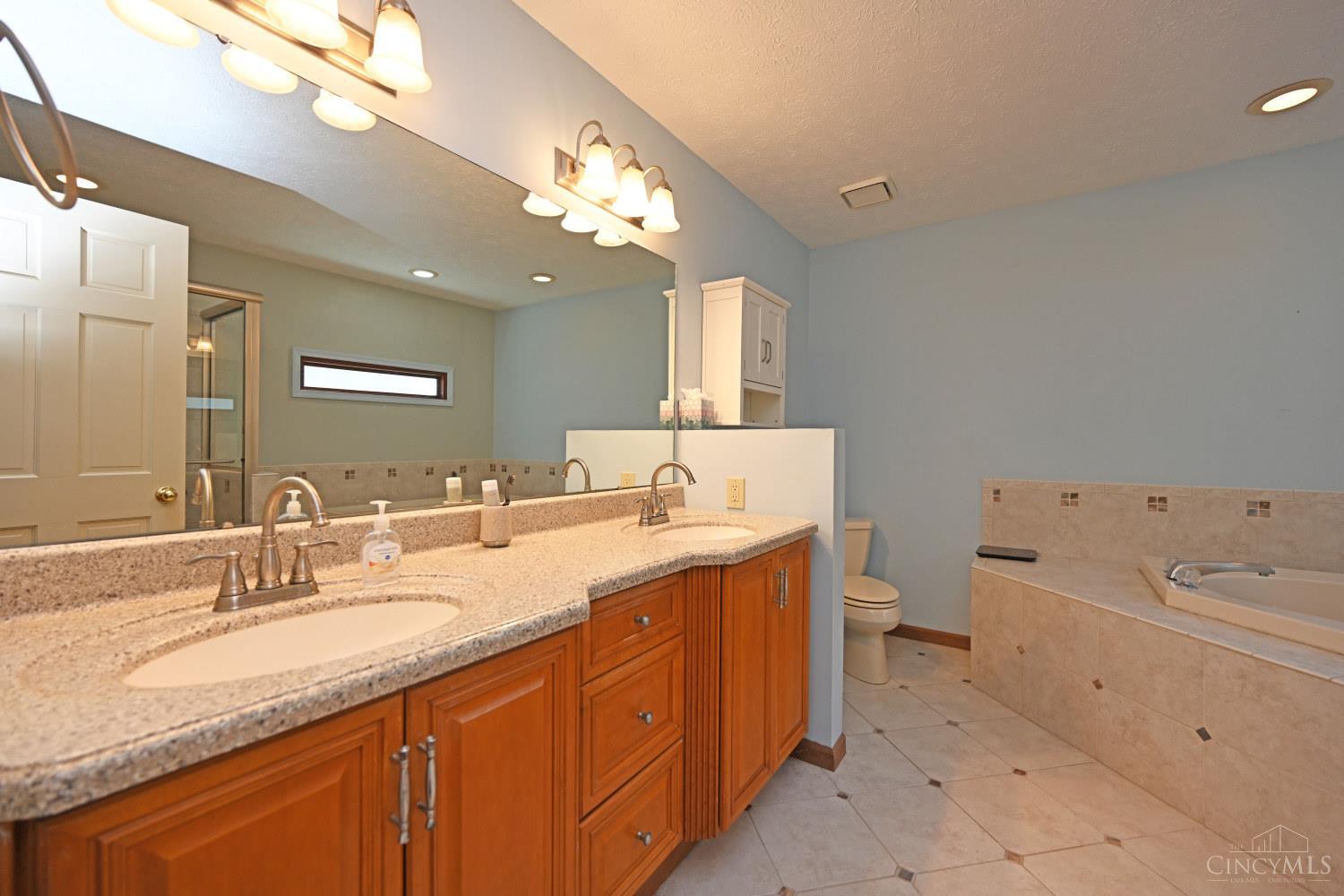 3444 Cutter Lane Maineville, OH 45039 - Photo 30 of 62 Primary bath has nice tile work and double vanity!