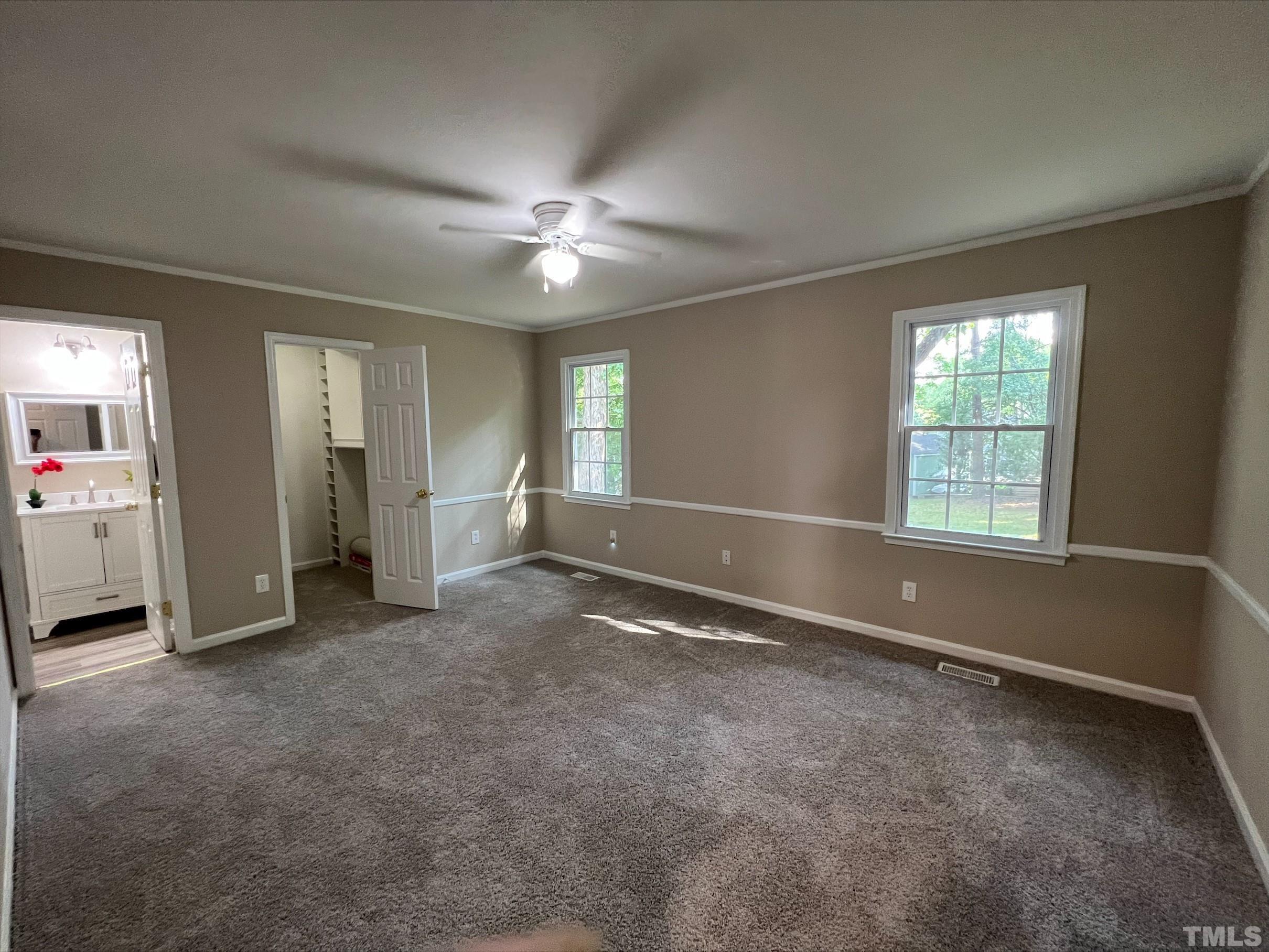 605 Sawmill Road Raleigh, NC 27615 - Photo 11 of 26 an empty room with windows and closet