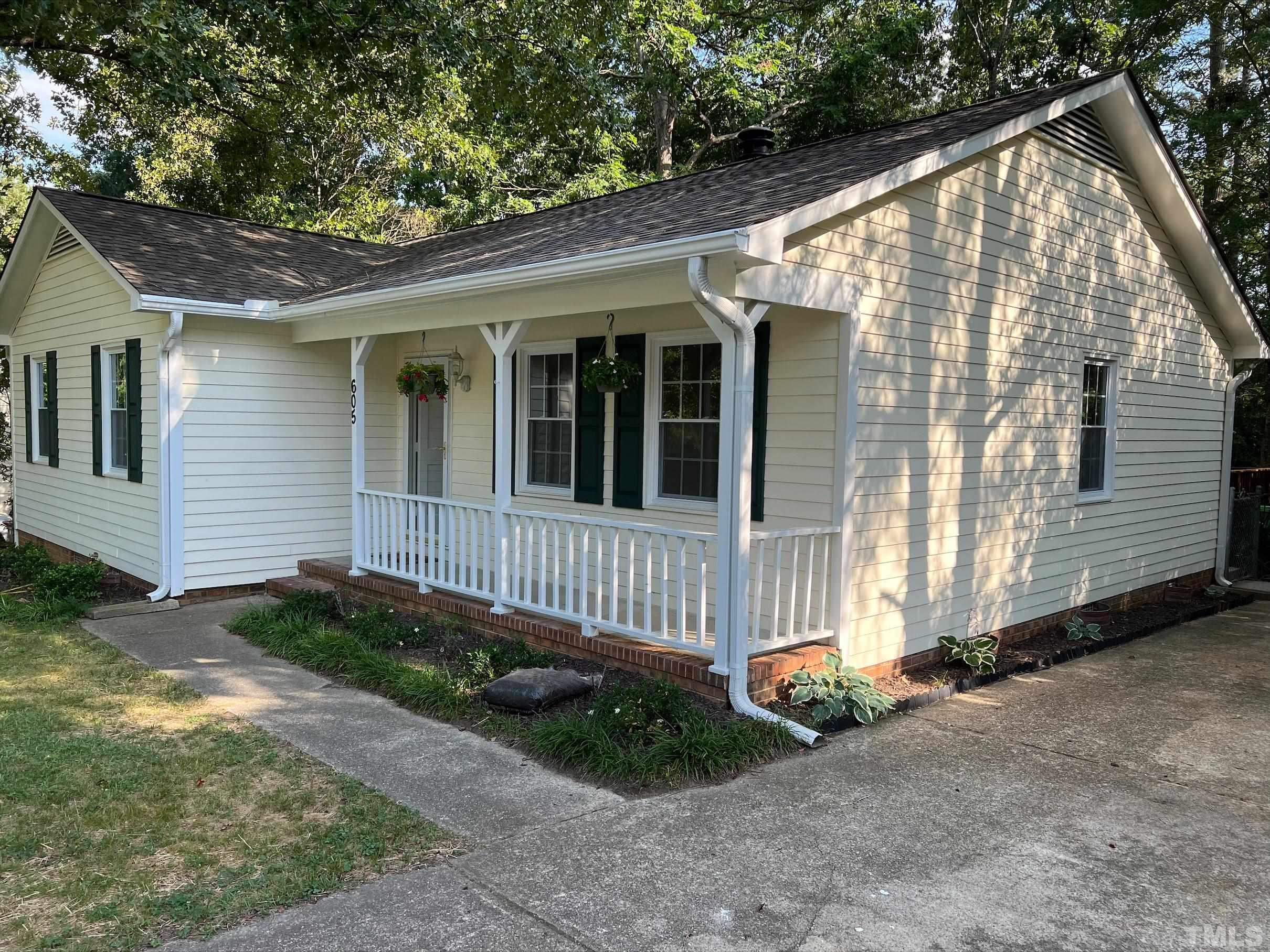 605 Sawmill Road Raleigh, NC 27615 - Photo 2 of 26 a view of a house with a small yard and wooden fence
