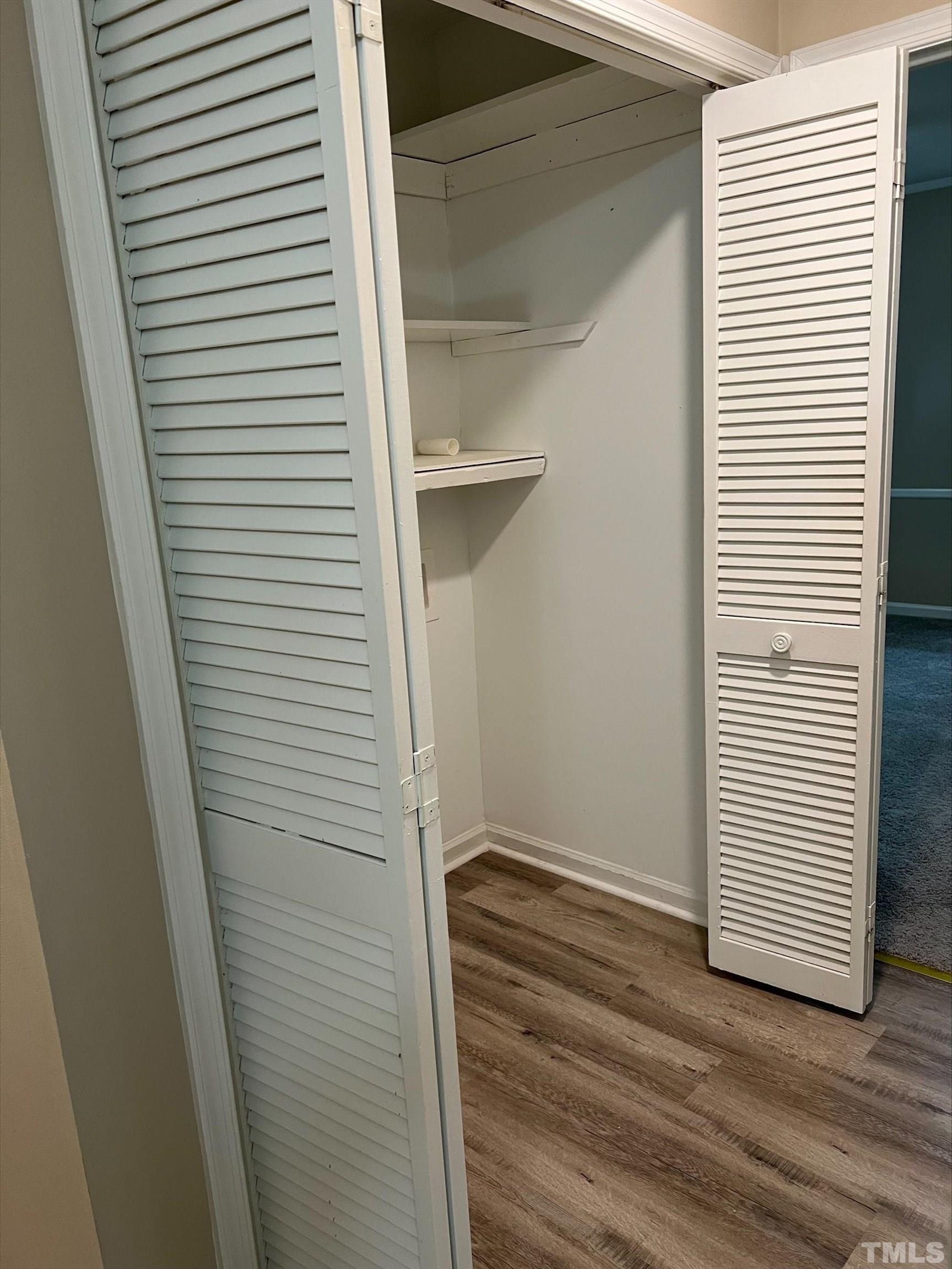605 Sawmill Road Raleigh, NC 27615 - Photo 21 of 26 a view of small space with racks on the wall