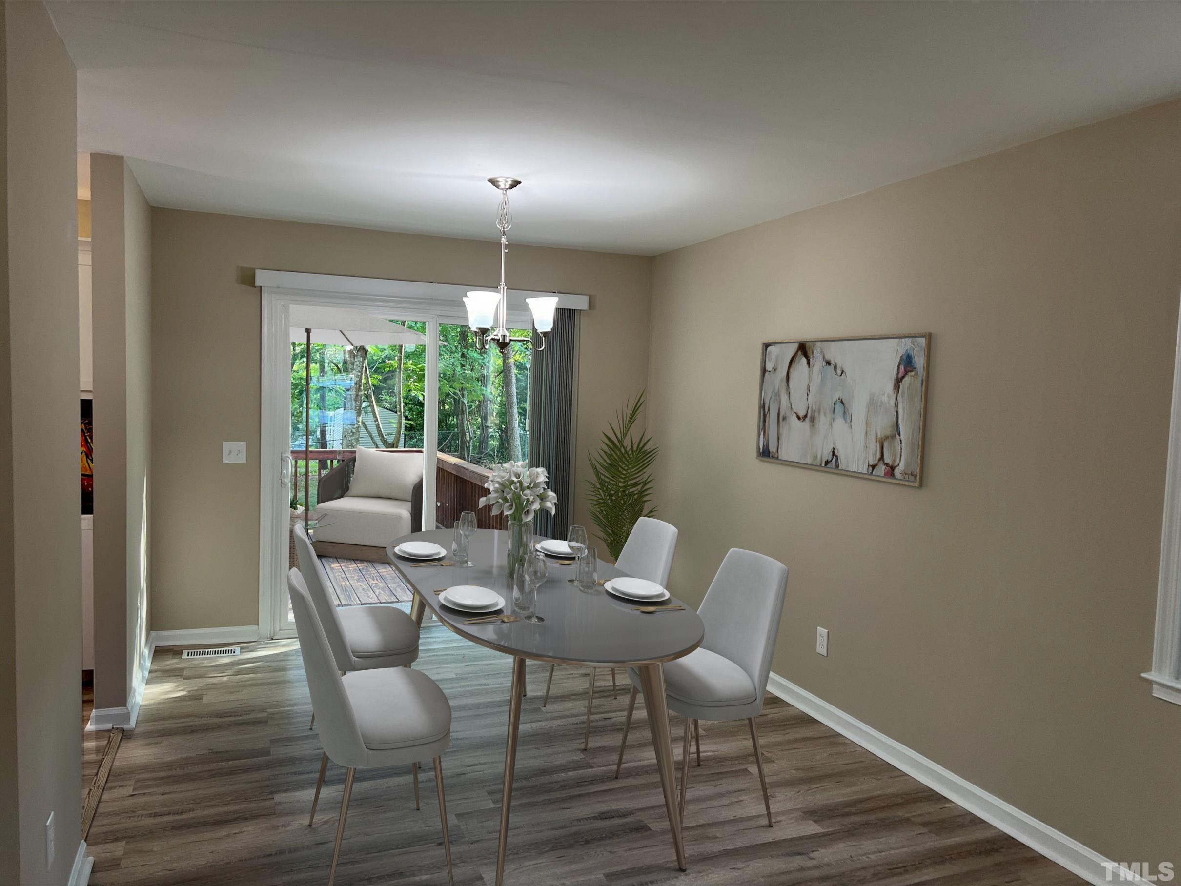 605 Sawmill Road Raleigh, NC 27615 - Photo 22 of 26 a view of a livingroom with furniture window and wooden floor