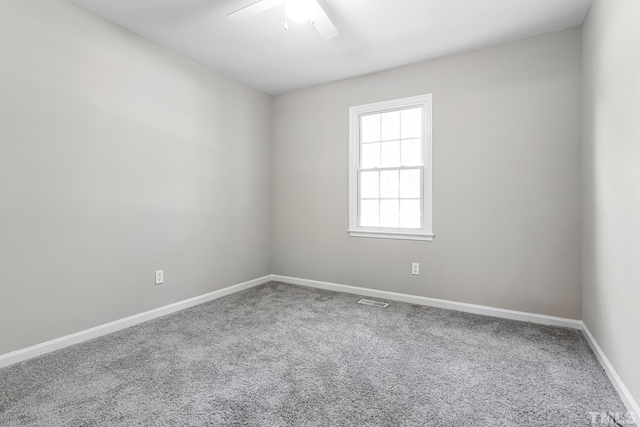 605 Sawmill Road Raleigh, NC 27615 - Photo 26 of 26 an empty room with windows