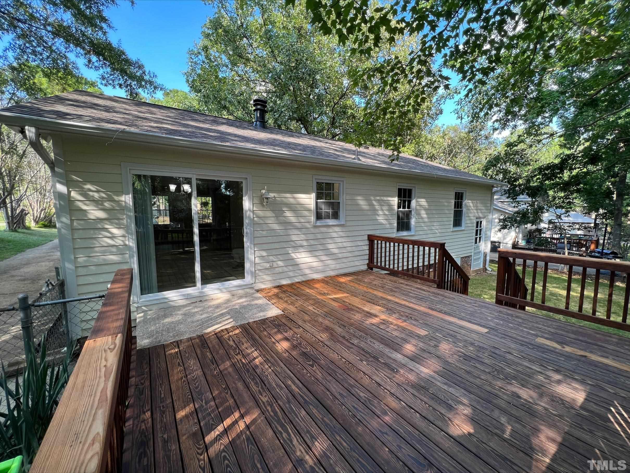 605 Sawmill Road Raleigh, NC 27615 - Photo 4 of 26 a view of backyard with a deck and wooden floor