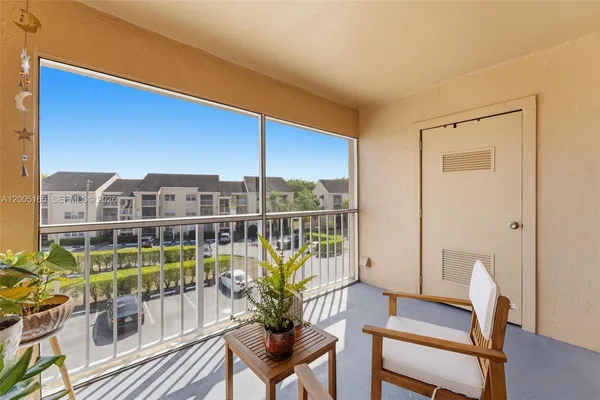 a view of a balcony with chairs