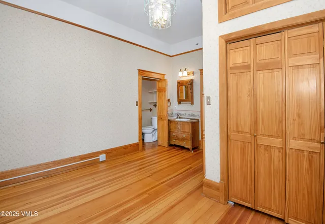 a very nice looking living room with furniture and a potted plant