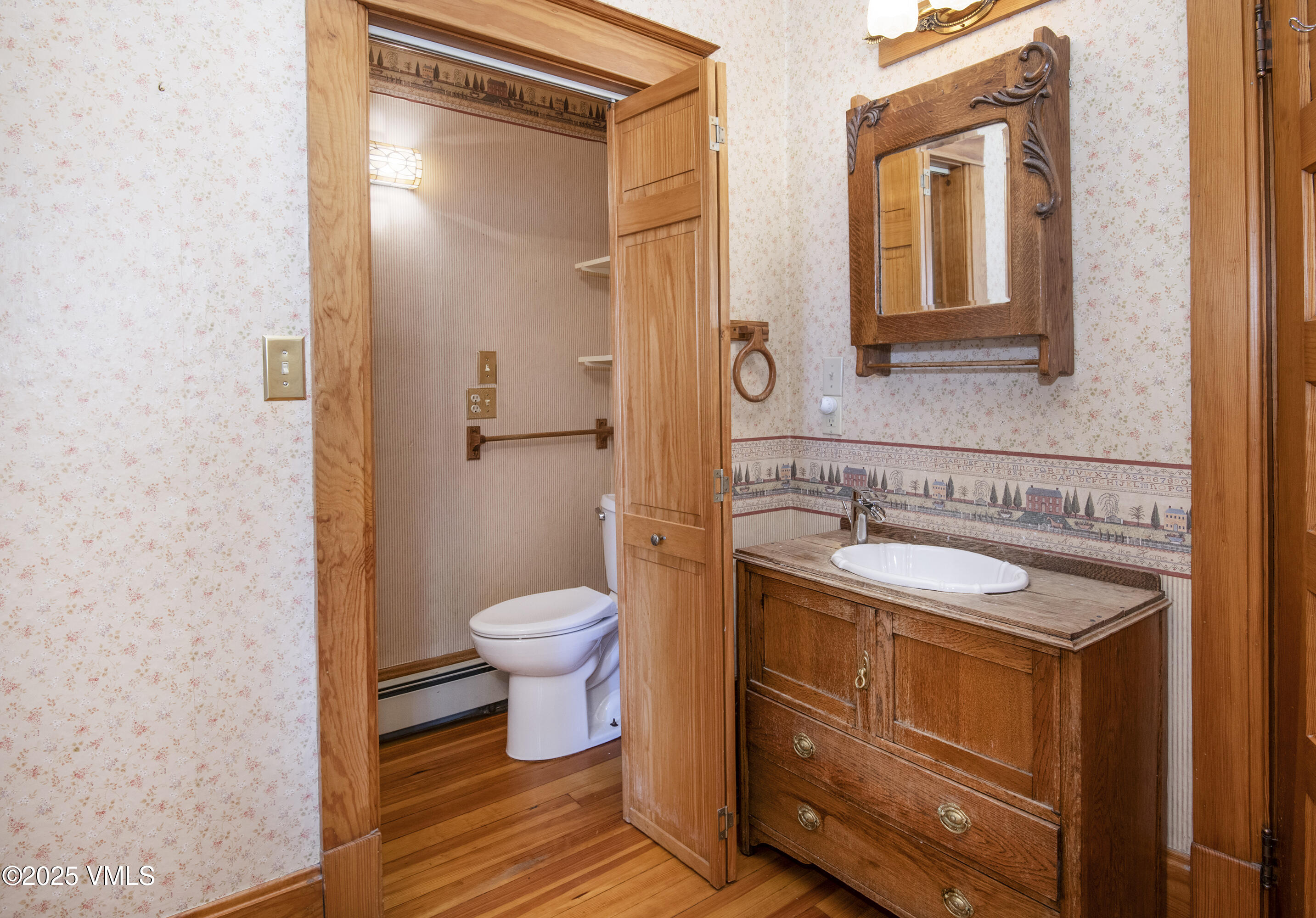 409 Washington Street Eagle, CO 81631 - Photo 12 of 28 a bathroom with a granite countertop sink toilet and shower