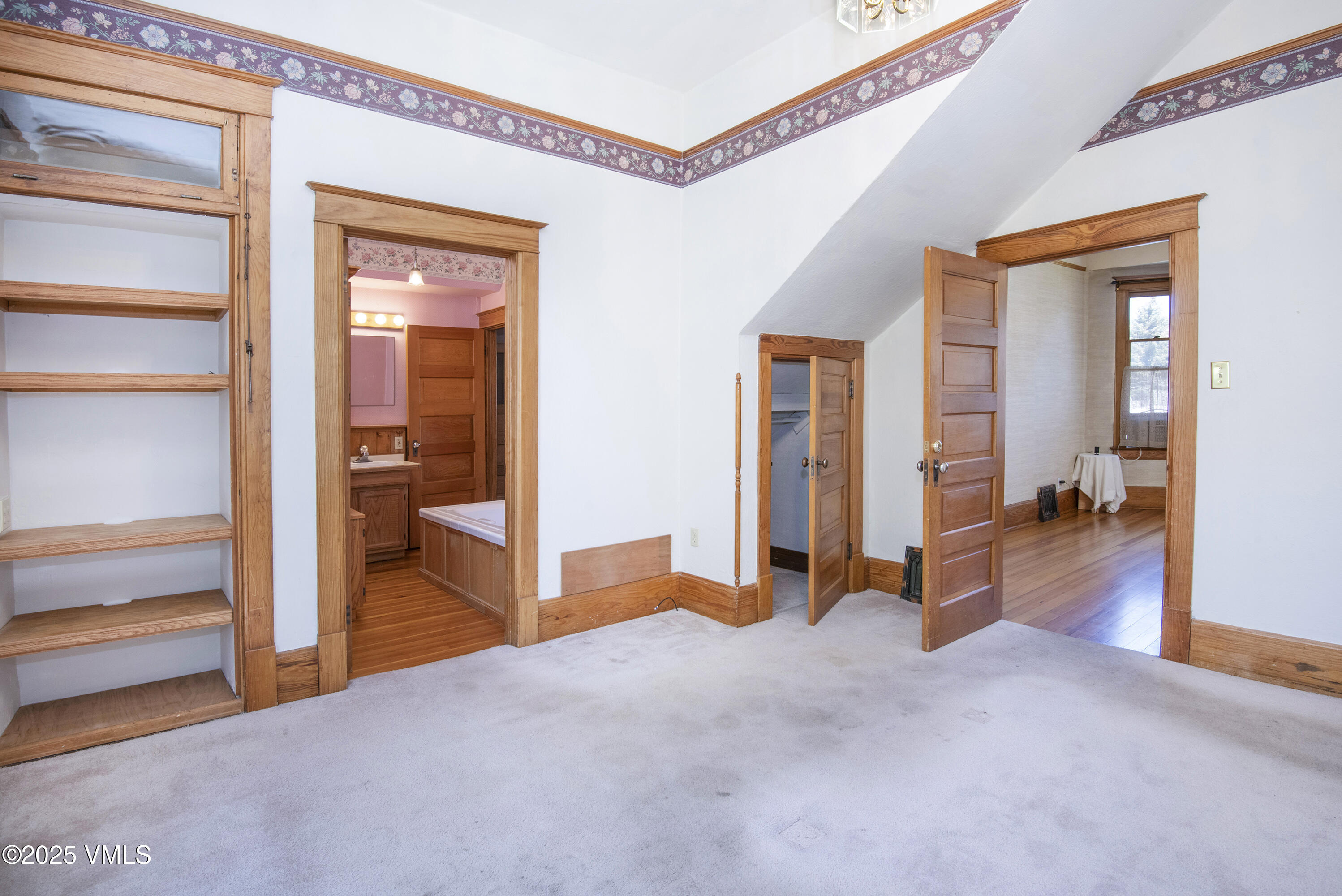 409 Washington Street Eagle, CO 81631 - Photo 13 of 28 a view of a livingroom with a hall and a ceiling fan