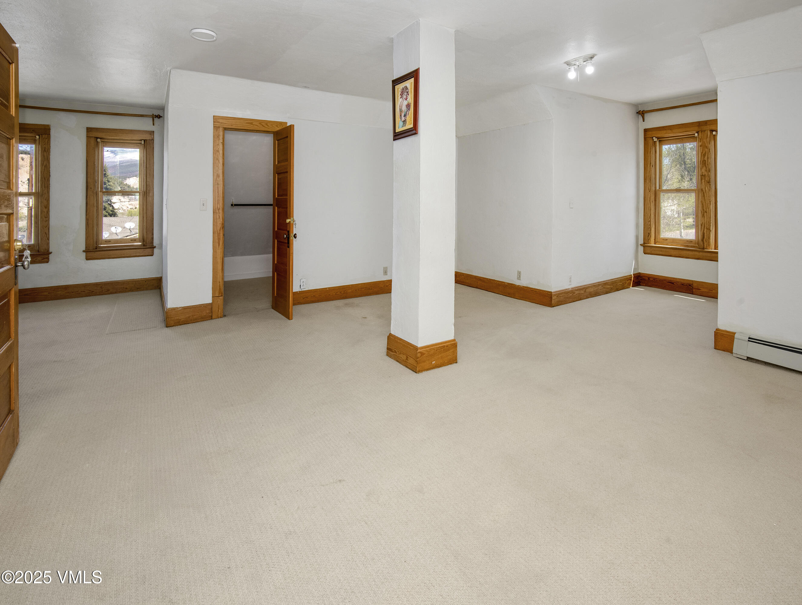 409 Washington Street Eagle, CO 81631 - Photo 15 of 28 an empty room with windows and closet