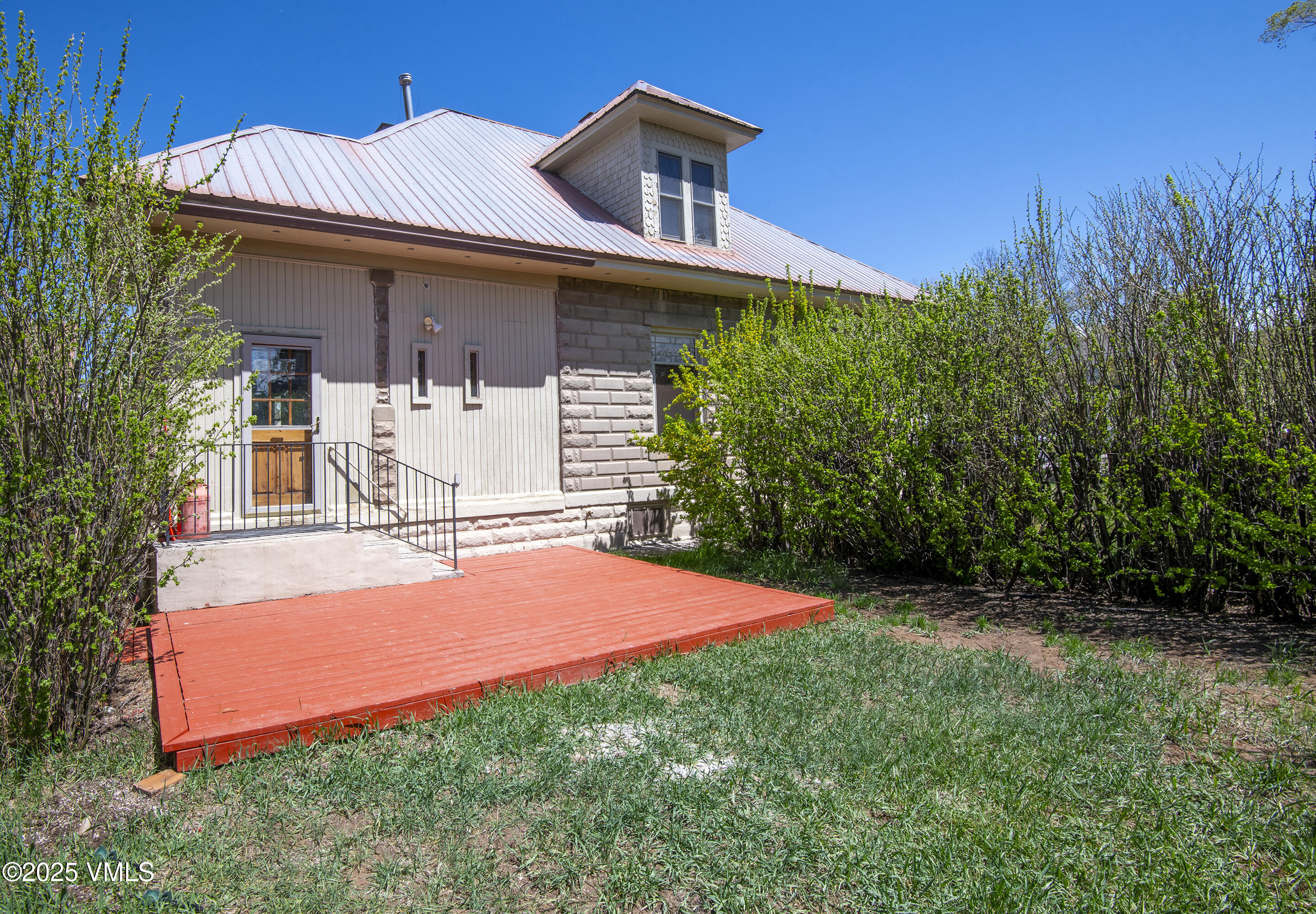 409 Washington Street Eagle, CO 81631 - Photo 20 of 28 a front view of house with yard and trees