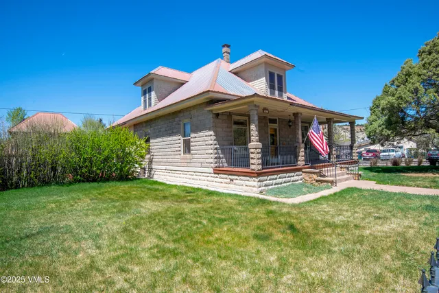a view of empty room with wooden floor and outer view