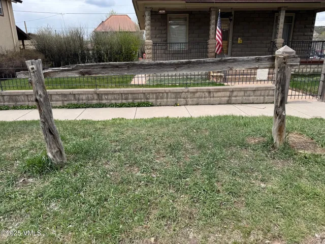a kitchen with appliances and wooden floor