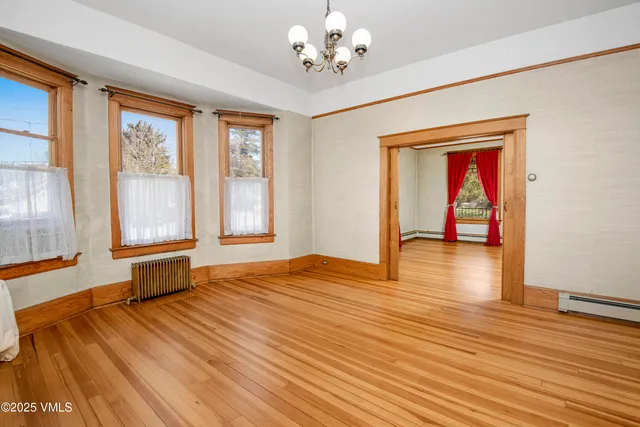 a front view of house with yard and trees