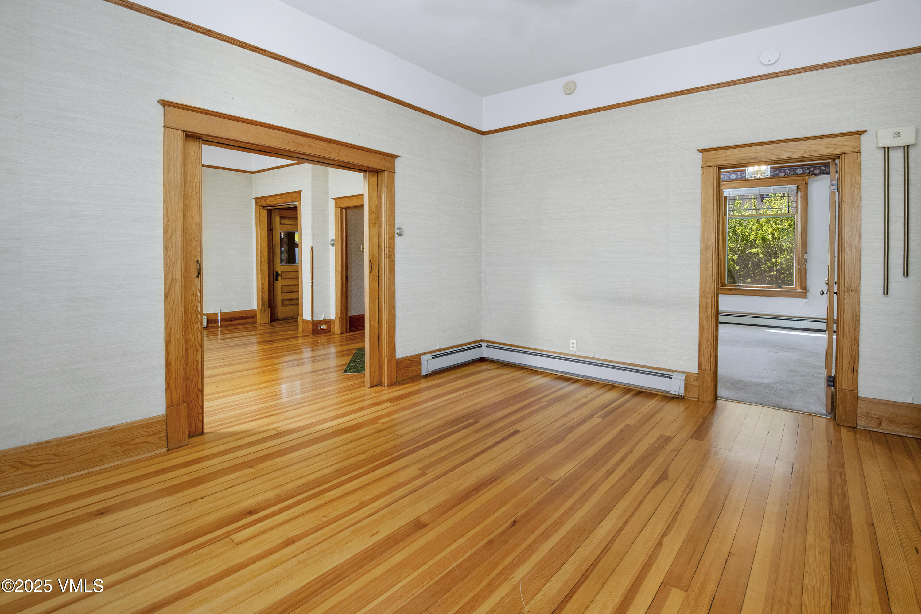 409 Washington Street Eagle, CO 81631 - Photo 9 of 28 a view of empty room with wooden floor and outer view