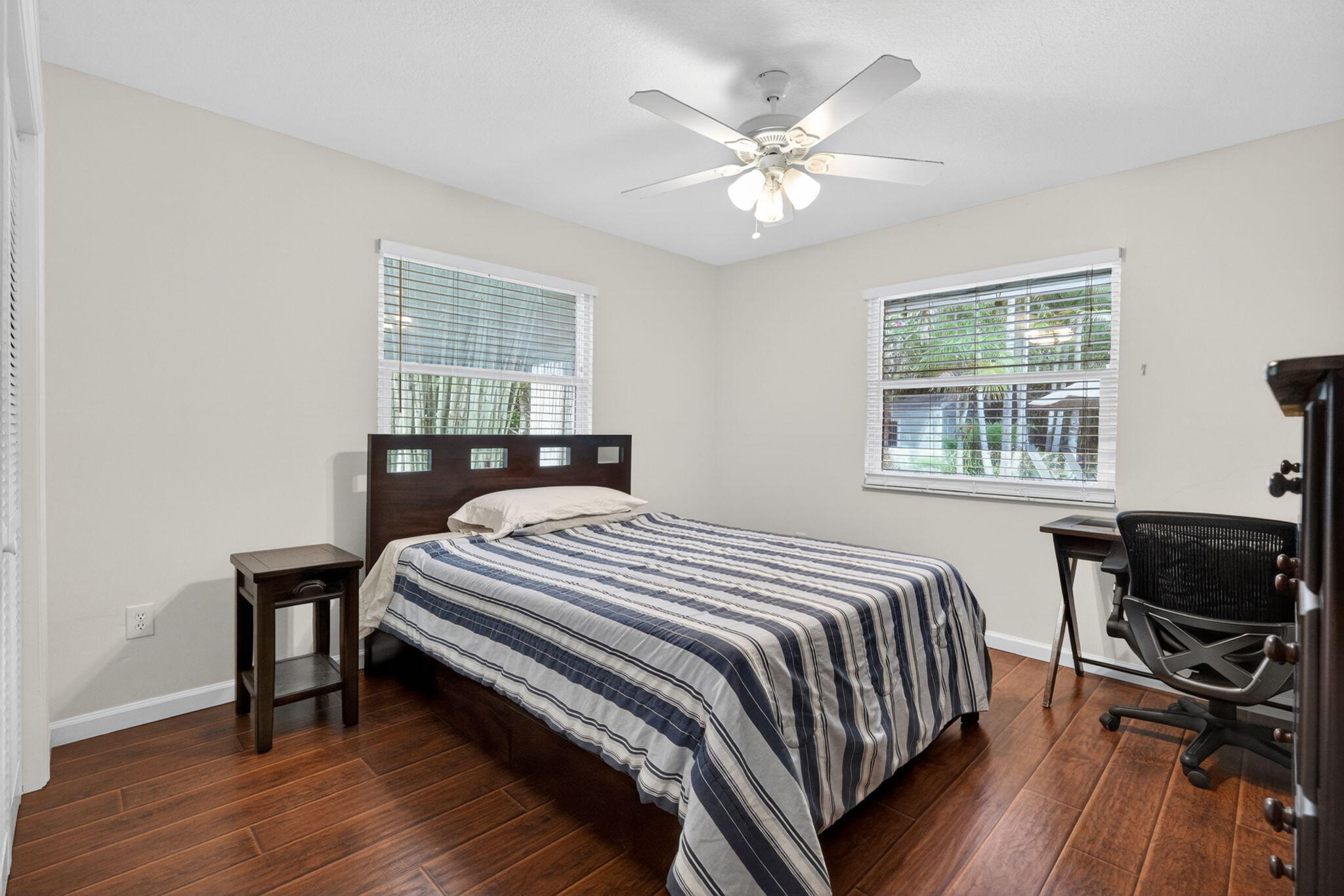 17391 Alexander Run Jupiter, FL 33478 - Photo 19 of 55 a bedroom with a bed a table and chair