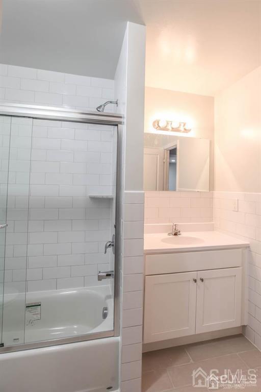 3004 Hana Road Edison, NJ 08817 - Photo 12 of 14 a bathroom with a bathtub and a sink
