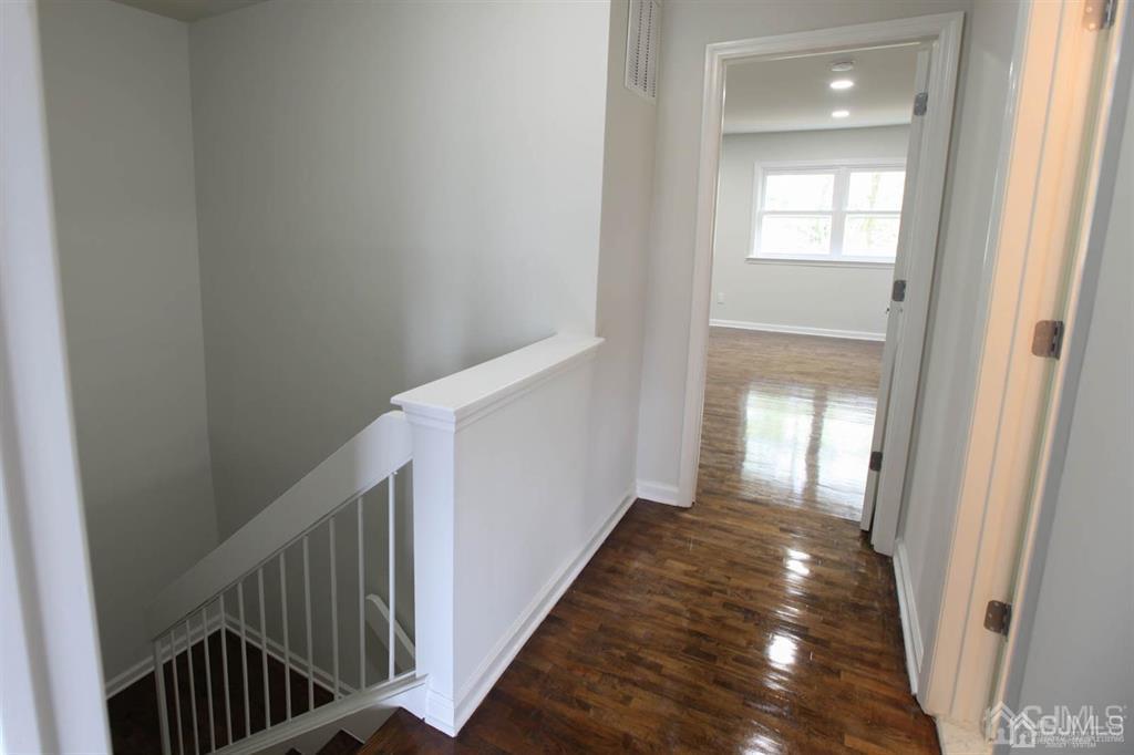 3004 Hana Road Edison, NJ 08817 - Photo 10 of 14 a view of a hallway with a white walls and stairs