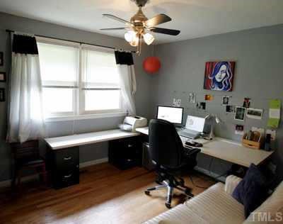 2260 Rumson Road Raleigh, NC 27610 - Photo 10 of 12 a view of a workspace with furniture and a window