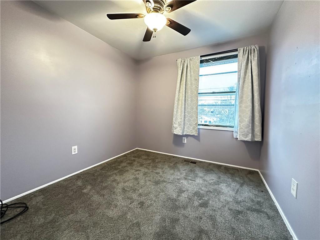 107 Fosterville Road Greensburg, PA 15601 - Photo 13 of 24 an empty room with windows and fan