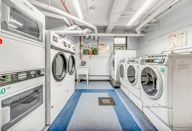a utility room with dryer washer and dryer