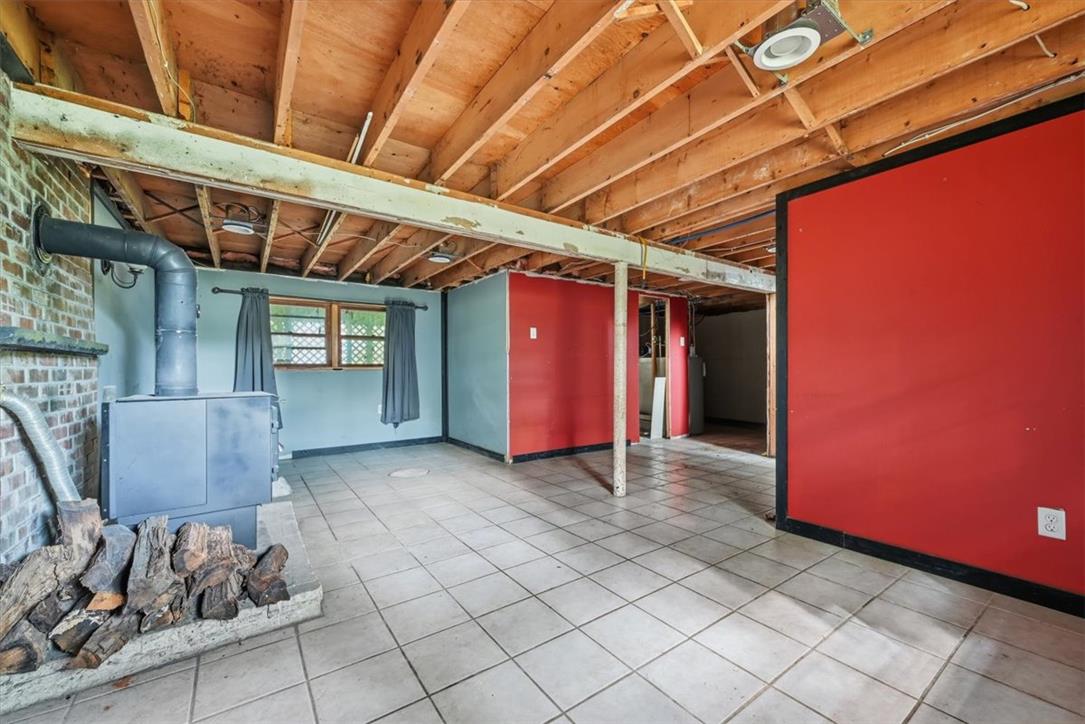 9870 North Delaware Drive Bangor, PA 18013 - Photo 37 of 62 Tiled floors and exposed ceiling joists define this versatile lower level living area.