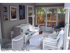3333 Kings Road South St. Augustine, FL 32086 - Photo 3 of 11 a living room with furniture and large windows