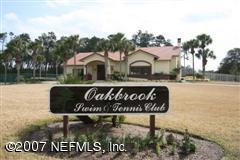 3333 Kings Road South St. Augustine, FL 32086 - Photo 5 of 11 a front view of a house with garden