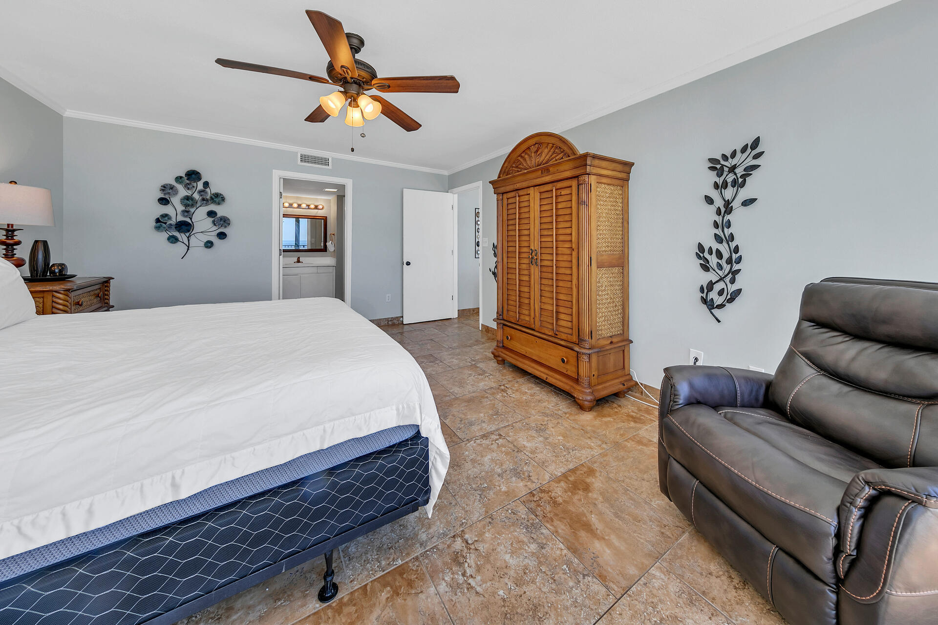 17351 Front Beach Road, Unit W602 Panama City Beach, FL 32413 - Photo 14 of 30 a spacious bedroom with a bed and a chandelier