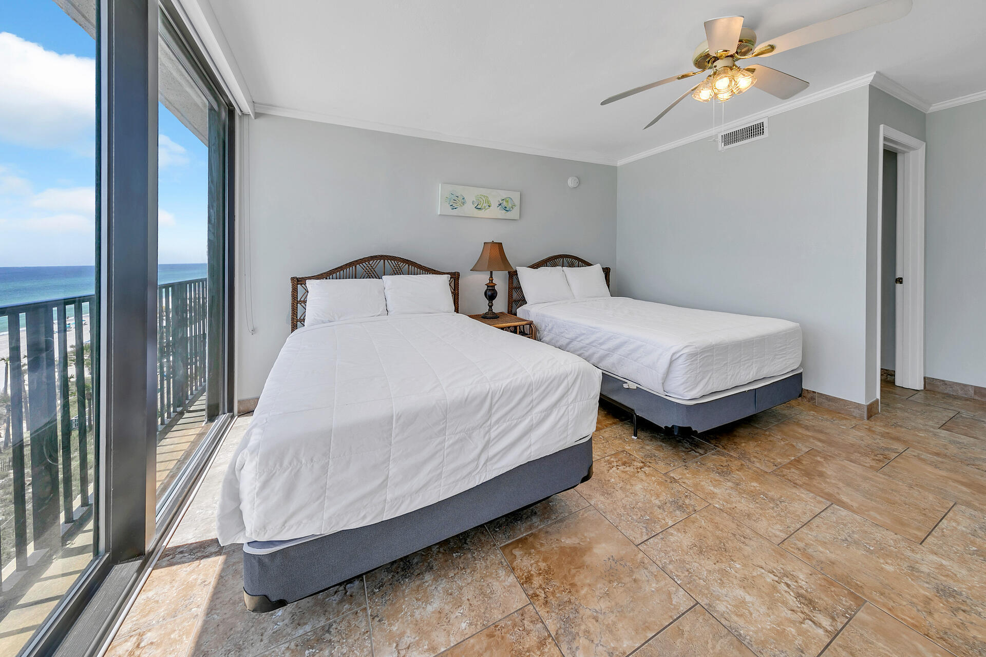 17351 Front Beach Road, Unit W602 Panama City Beach, FL 32413 - Photo 19 of 30 a bedroom with bed and a chandelier