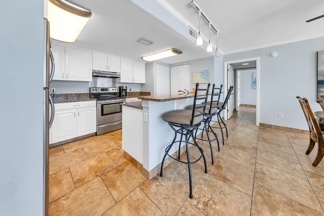 a view of a dining room kitchen and a window