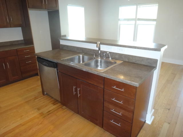 149 Mandy Circle Santa Rosa Beach, FL 32459 - Photo 4 of 13 a kitchen with a granite countertop sink and cabinets