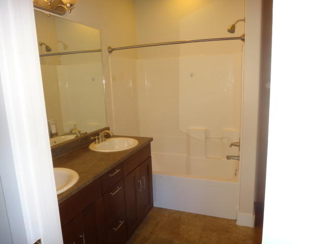 149 Mandy Circle Santa Rosa Beach, FL 32459 - Photo 8 of 13 a bathroom with a granite countertop sink and a mirror