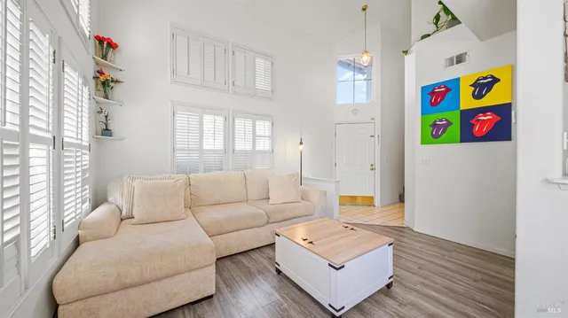 a living room with furniture and a window