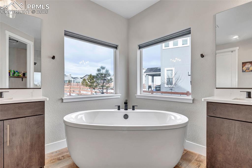 2402 Parma Court Colorado Springs, CO 80921 - Photo 27 of 45 a bathroom with a bathtub and a sink