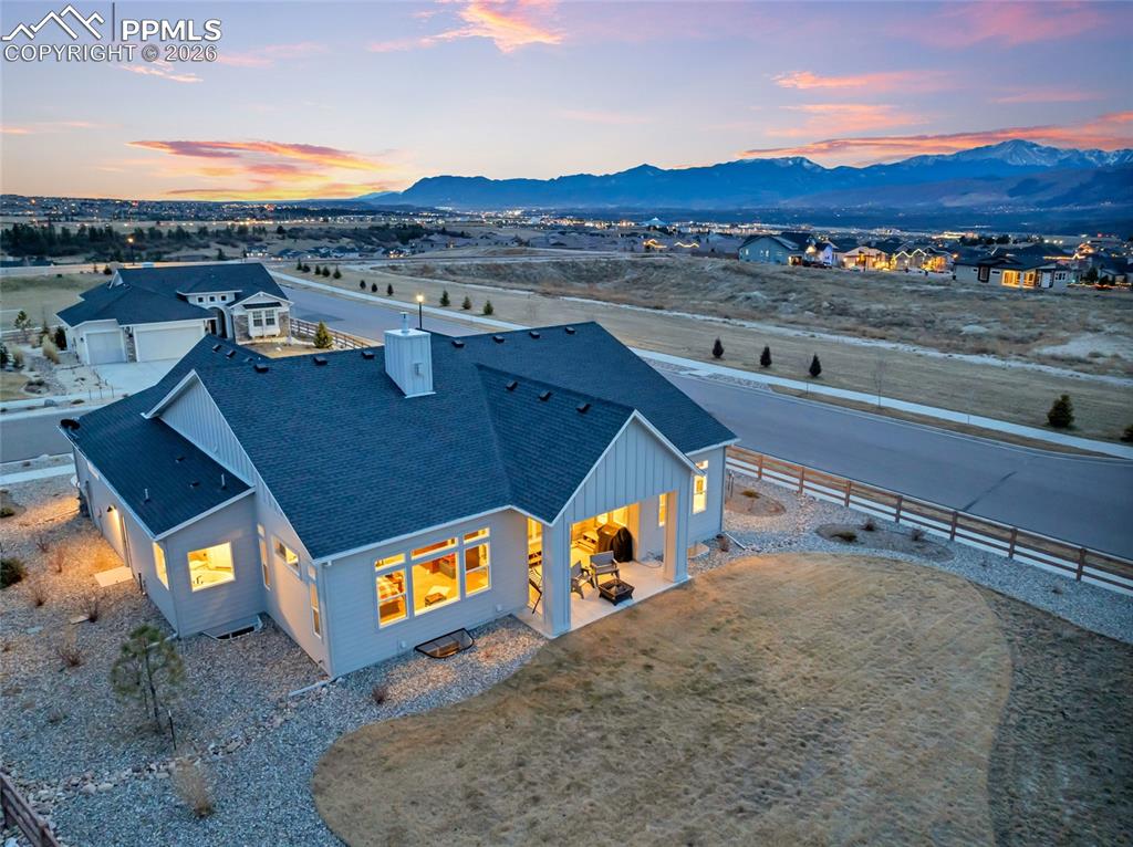 2402 Parma Court Colorado Springs, CO 80921 - Photo 44 of 45 a view of a swimming pool with a table and chairs
