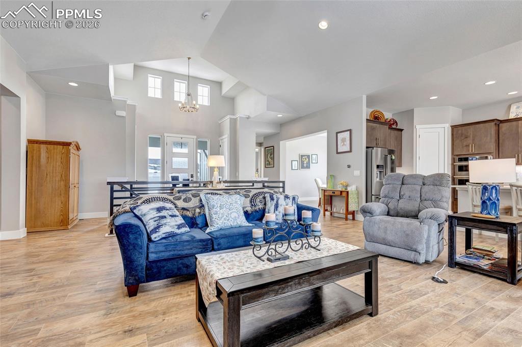 2402 Parma Court Colorado Springs, CO 80921 - Photo 10 of 45 a living room with furniture and a view of kitchen