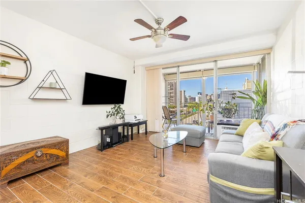 a living room with furniture and a flat screen tv