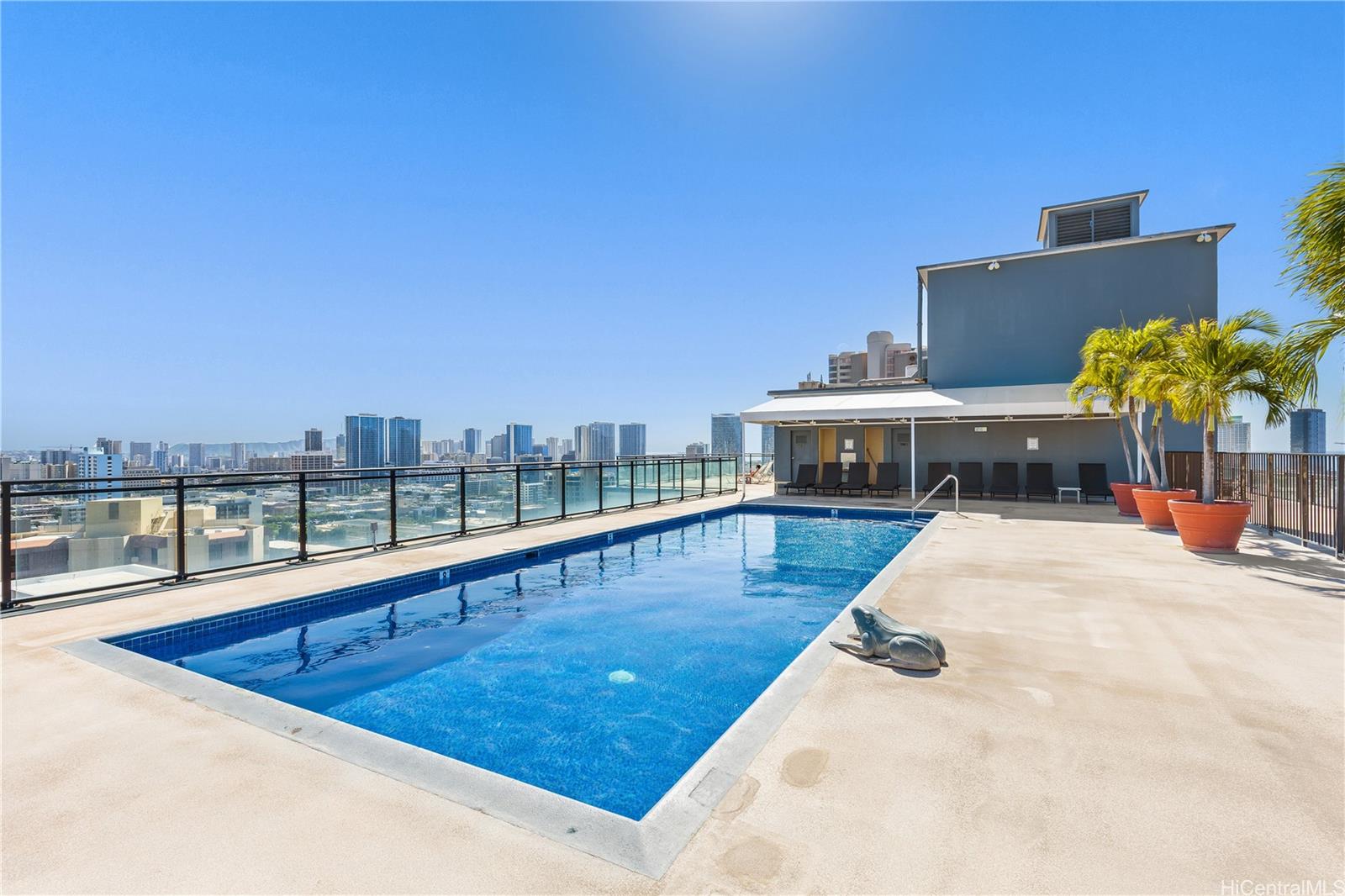 1415 Victoria Street, Unit 211 Honolulu, HI 96822 - Photo 15 of 21 a view of a swimming pool with a lounge chair