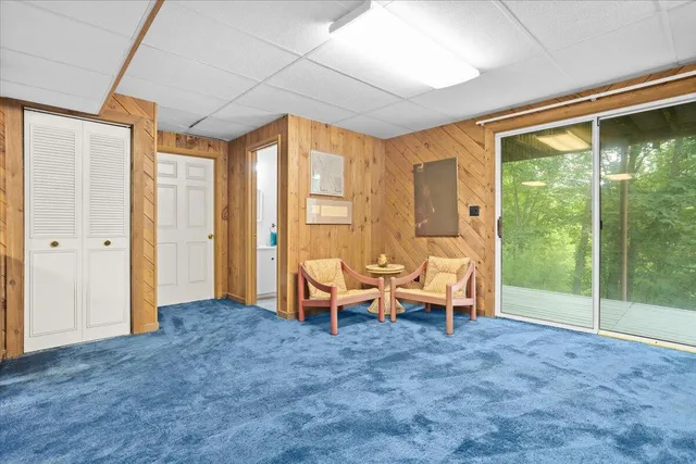 a bathroom with a sink and mirror with toilet