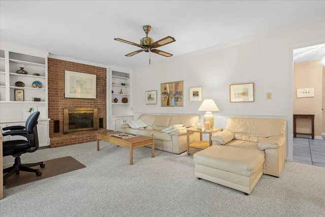 a living room with furniture a fireplace