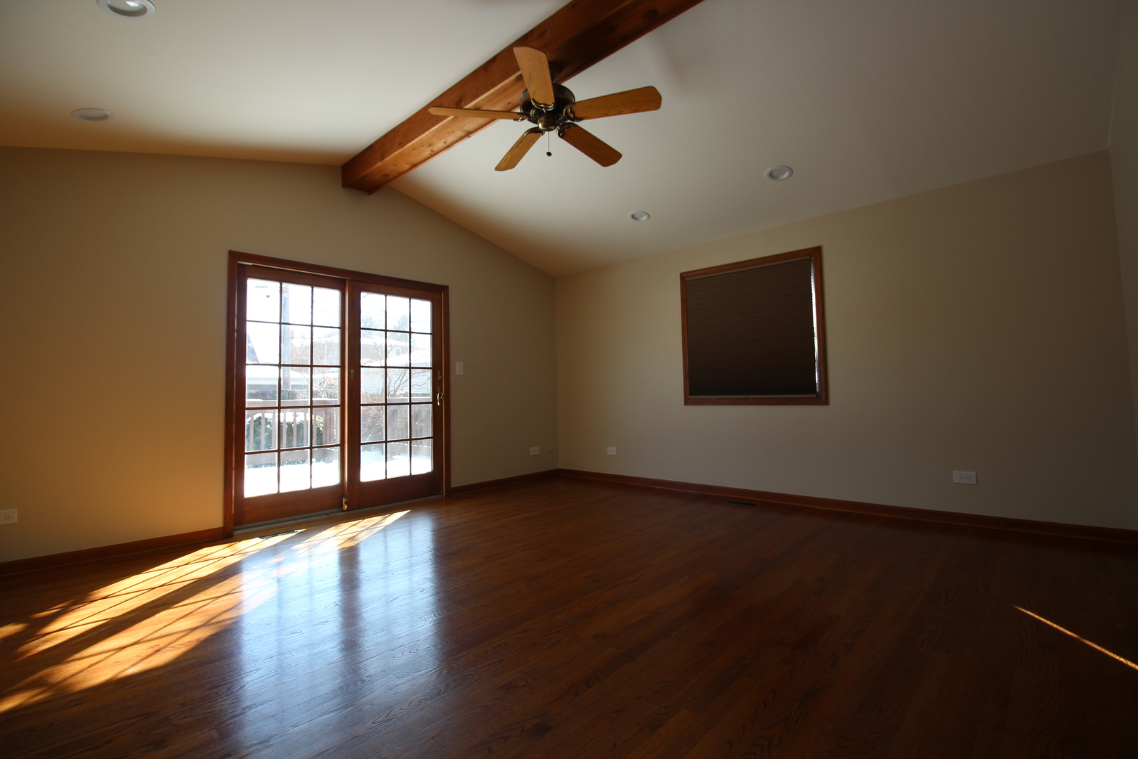 5237 North Olcott Avenue Chicago, IL 60656 - Photo 15 of 26 a view of an empty room with wooden floor and a window