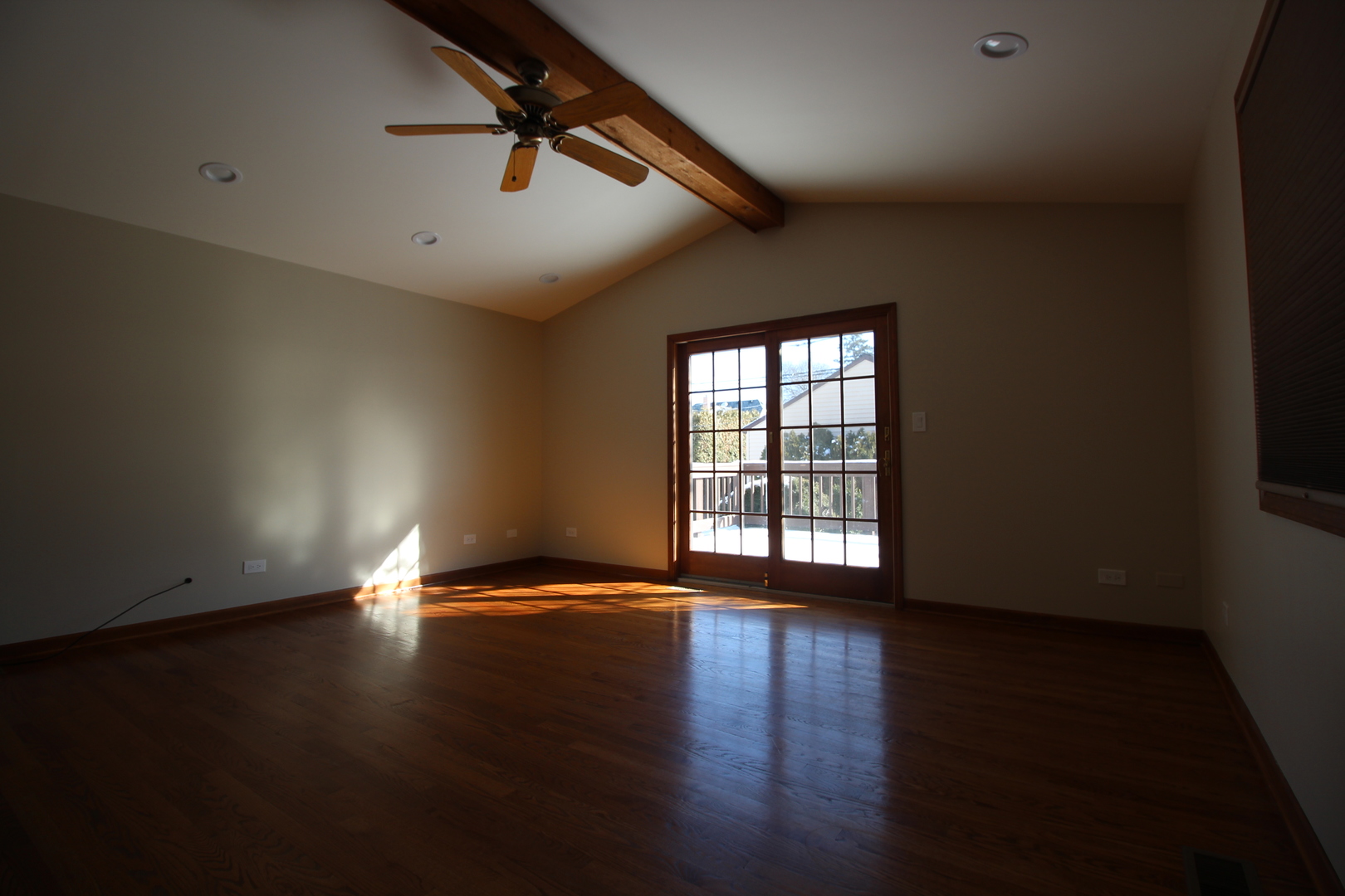 5237 North Olcott Avenue Chicago, IL 60656 - Photo 16 of 26 a view of an empty room with wooden floor and a window