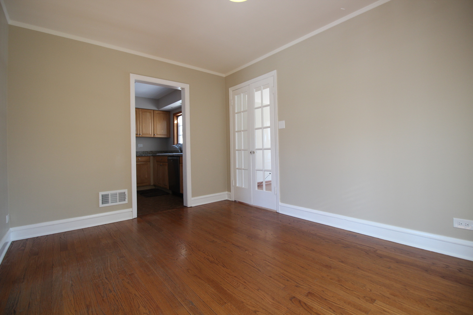5237 North Olcott Avenue Chicago, IL 60656 - Photo 6 of 26 a view of empty room with wooden floor and fan